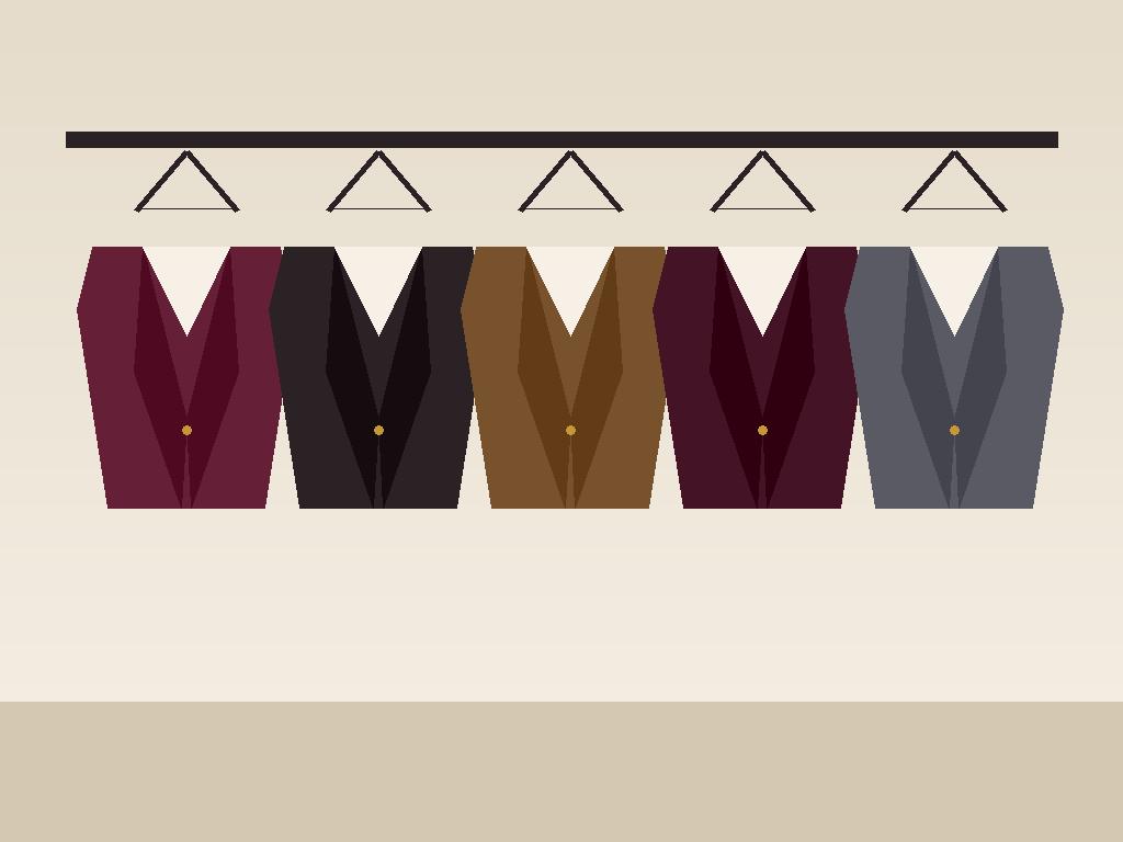 Row of finished bespoke suits hanging on a rail in the atelier